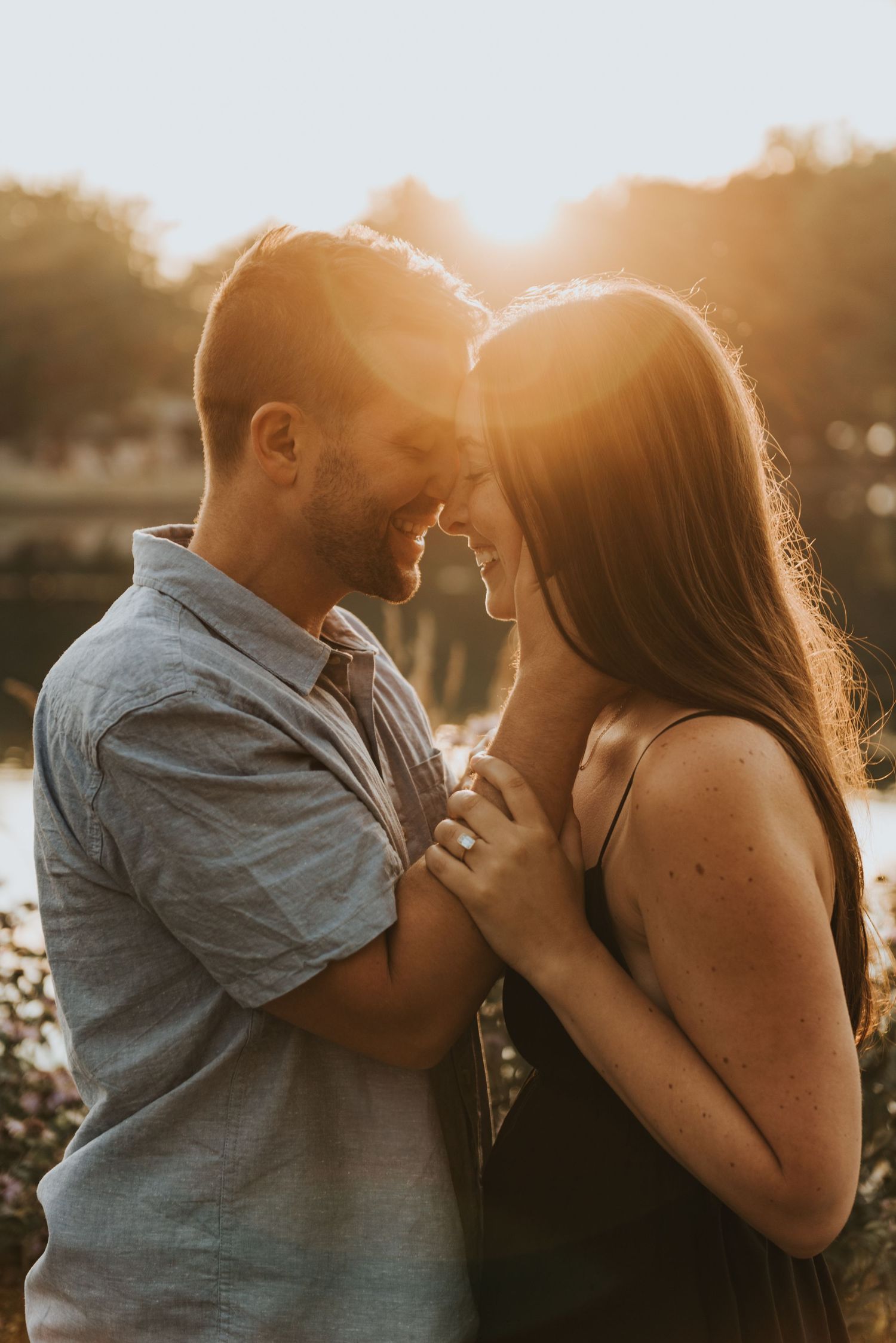 A romantic couple shares intimate moments at sunset by a lake in three similar photos.