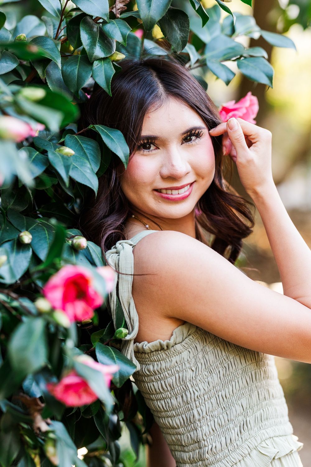 Outdoor senior photo session in Southern California with winter greenery