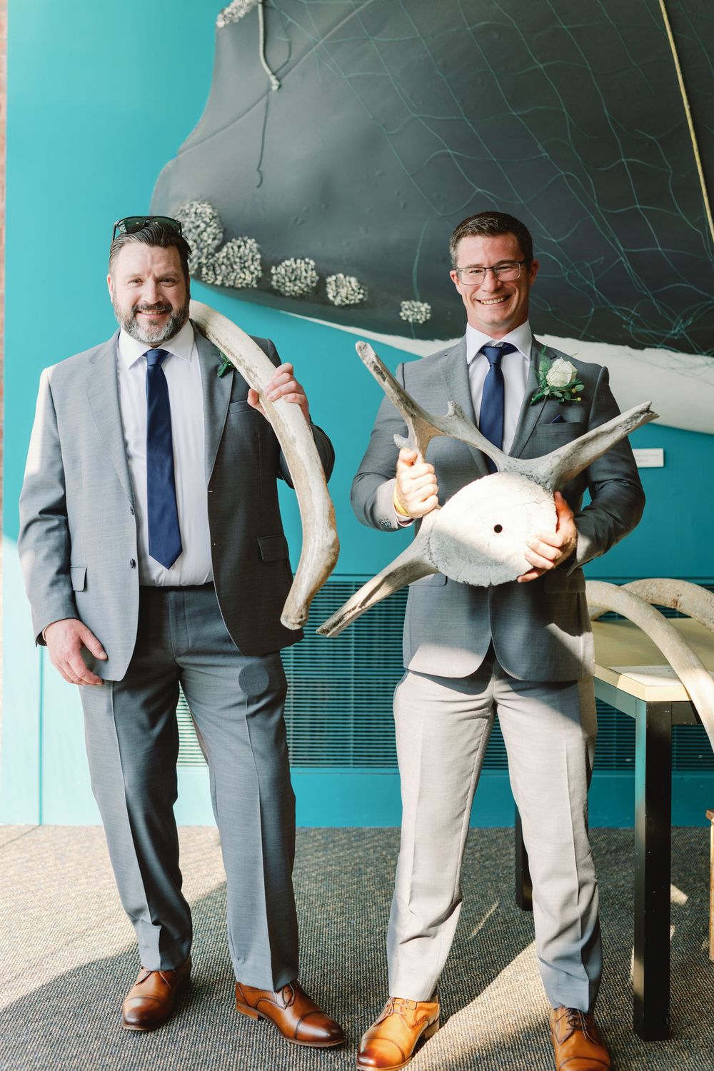 A series of photos showing legs of people in business attire and suits standing against a turquoise wall with a chalkboard.