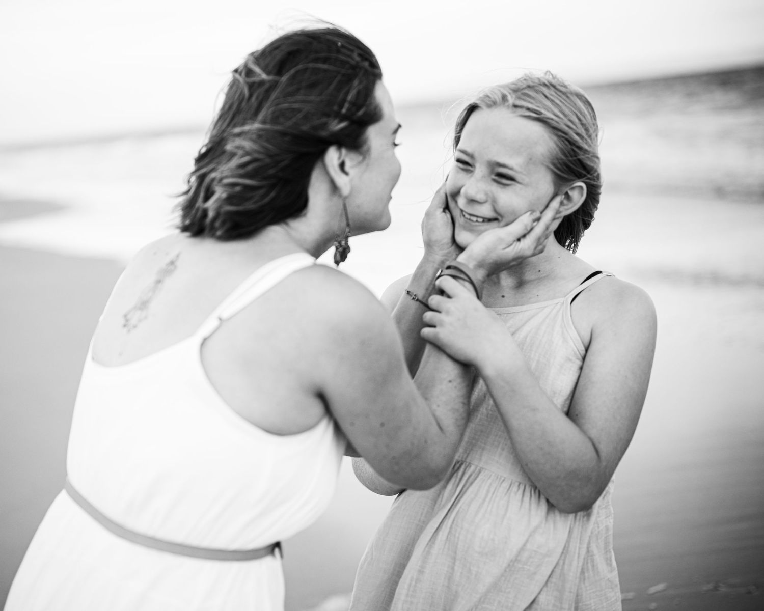Black and white romantic beach photoshoot sequence.