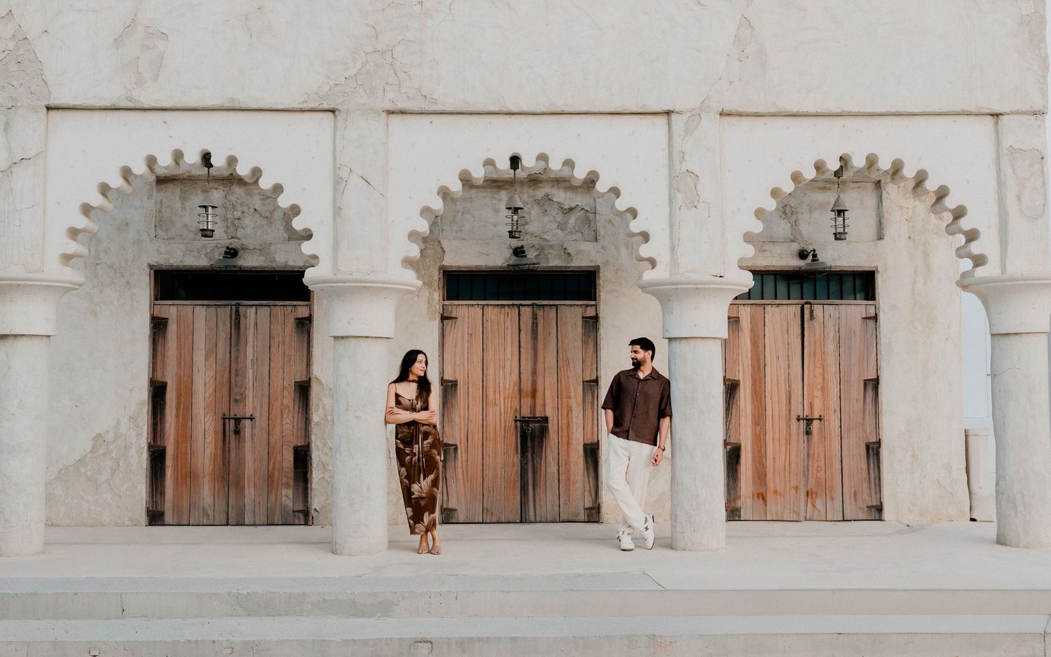 Couple photoshoot in Dubai with traditional Arabian architecture backdrop