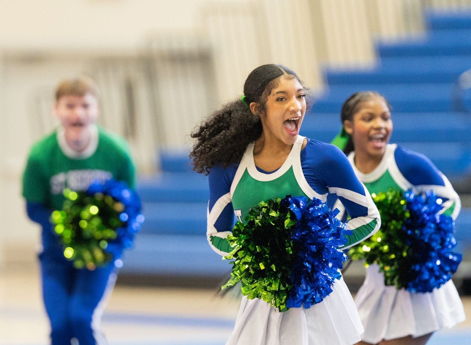 High school cheerleading action photographed with the Sony A7iii freezing motion indoors