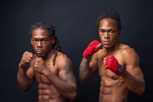 Series of boxing poses showing athletic form with red gloves against dark background. portrait photography st louis.