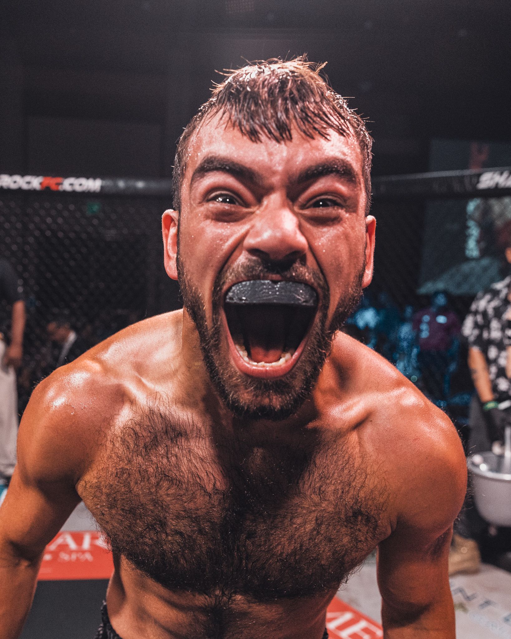 Close-up of intense fighter expression during MMA match. live event photography st louis.