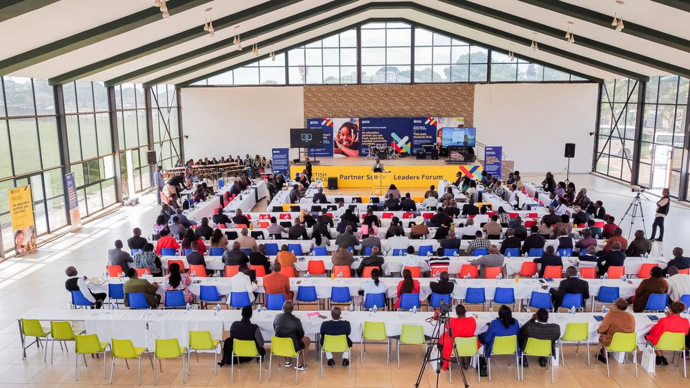 A panoramic collage showing multiple views of people seated in rows inside a bright gymnasium or community center.
