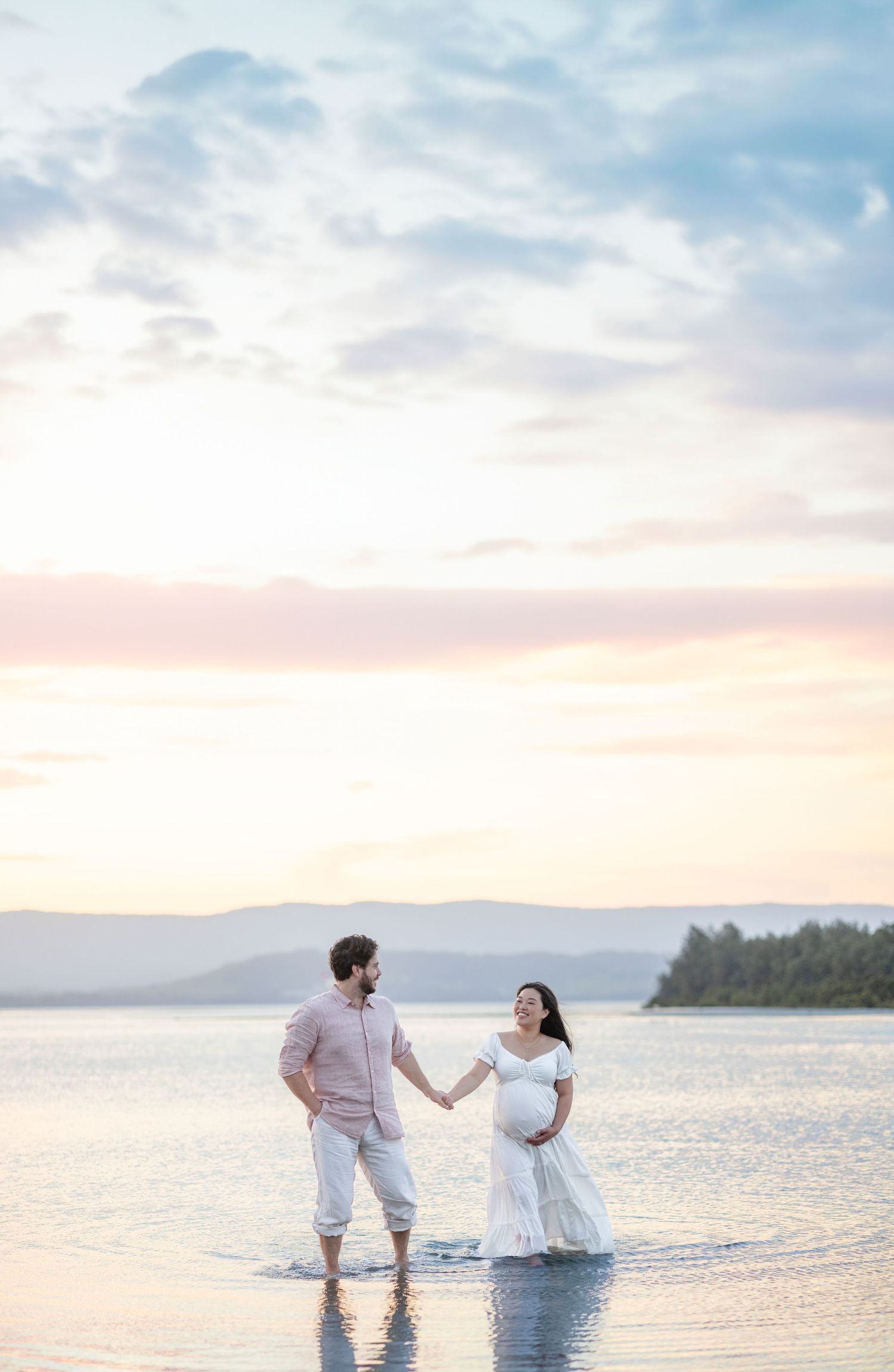 Couple Maternity photos at Lake Illawarra photographed with beautiful sky at sunset