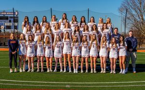Girls high school lacrosse team group photo on outdoor field, team photo day by SportsFox Photography, Hershey PA.