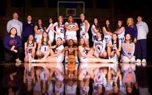 Hershey High School girls basketball team group photo in gym, athletes in white uniforms, team photo day by SportsFox Photography.