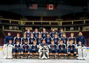 Hershey youth hockey team group photo on the ice, team photo day by SportsFox Photography, Hershey PA.