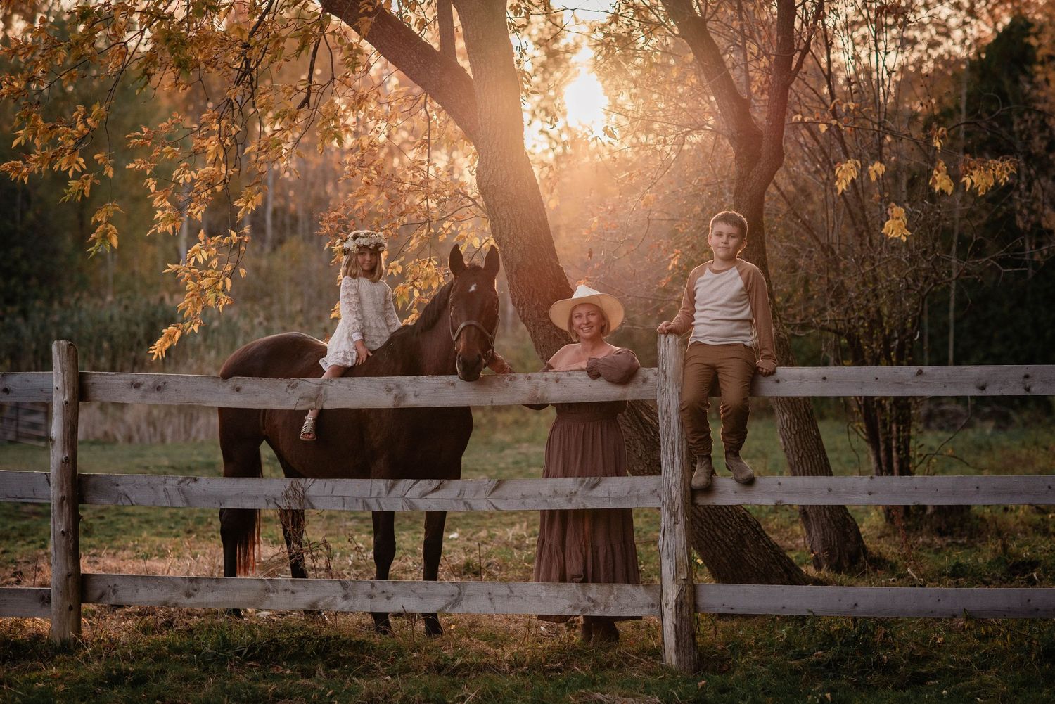 Family Photographer shooting a family and their horse at golden hour in Brock, Ontario.