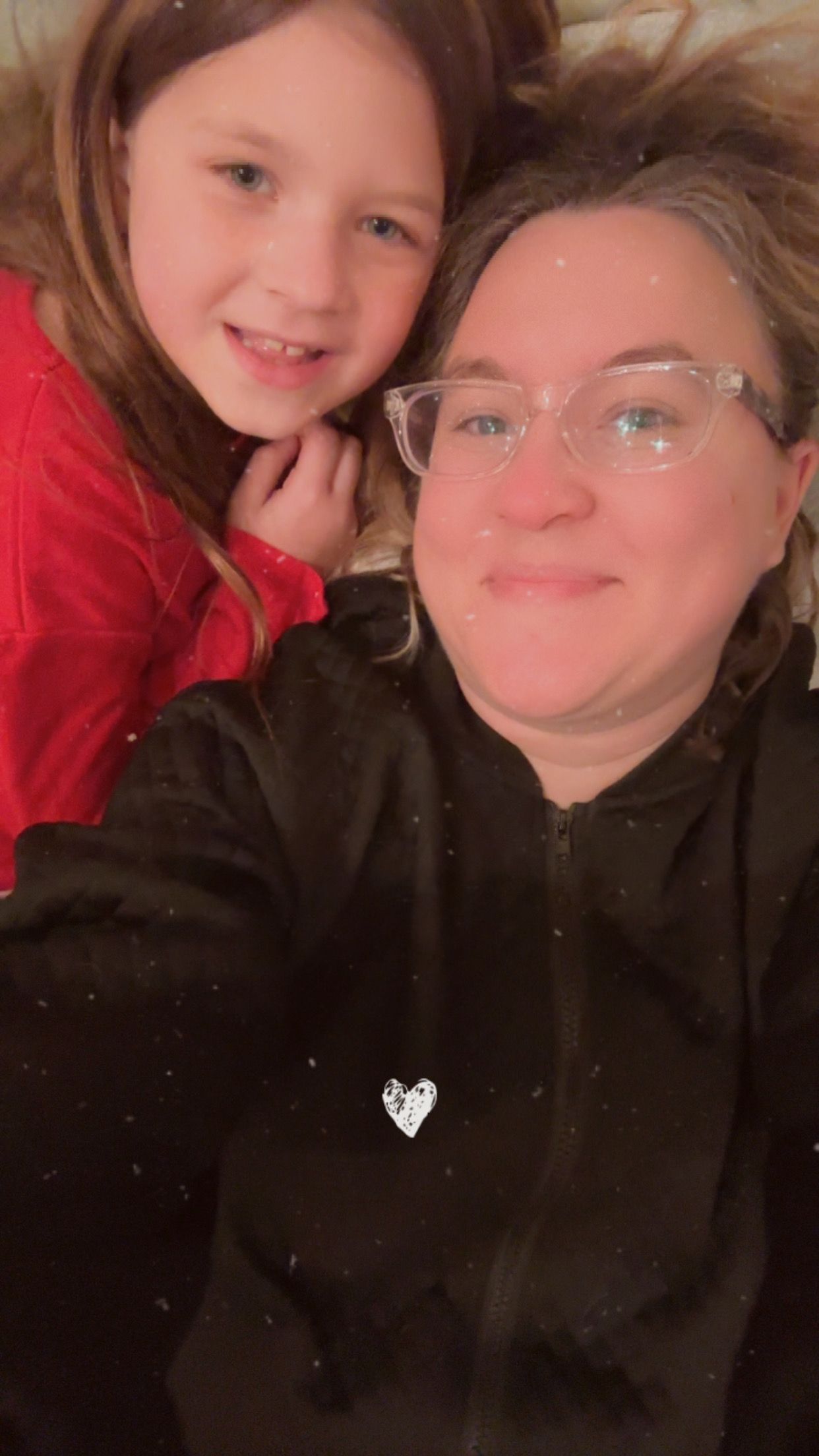 Cozy indoor selfie moment with warm lighting and festive atmosphere.