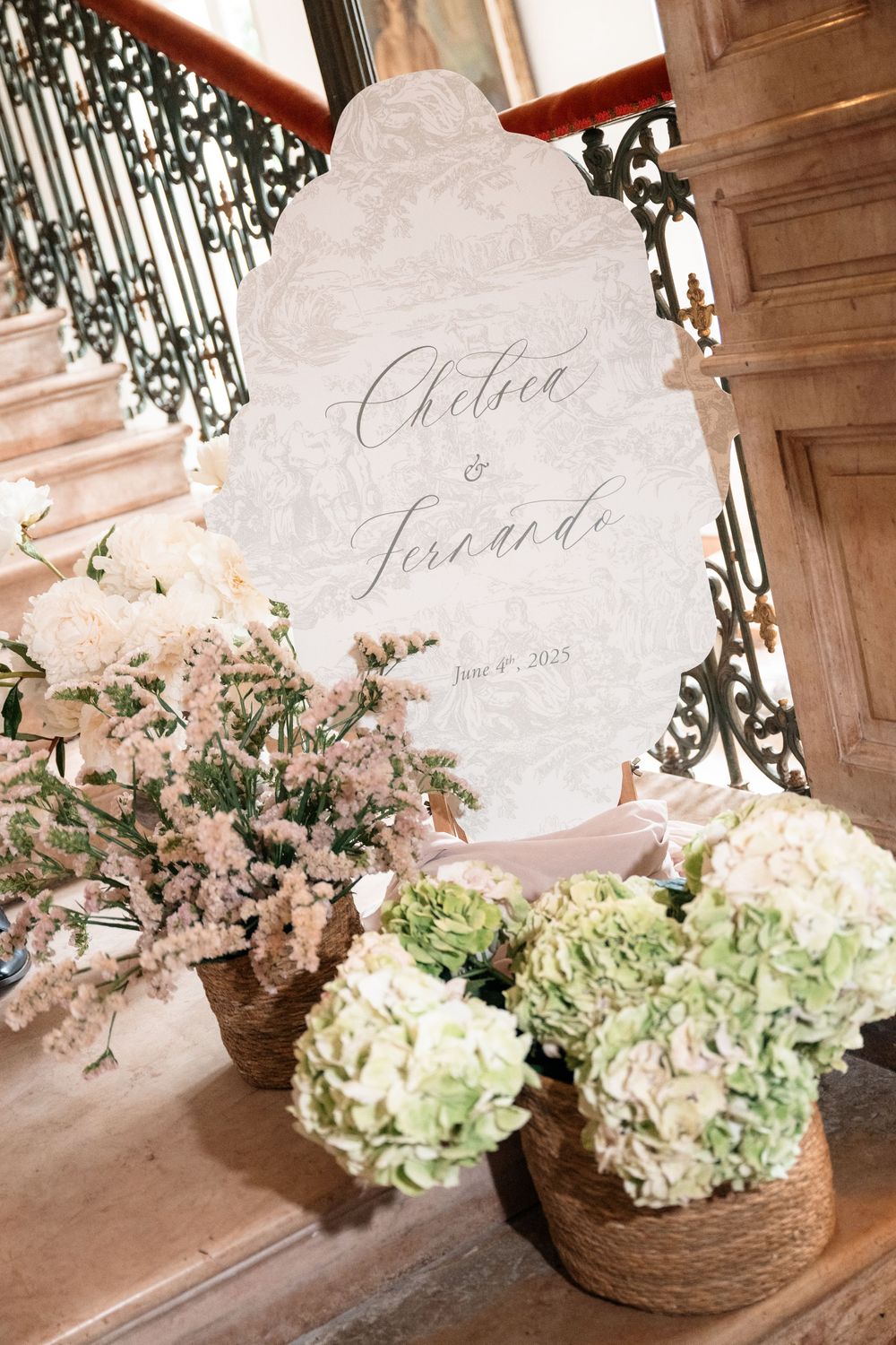 Rustic floral arrangements with hydrangeas and blush flowers in woven baskets against a textured wall.