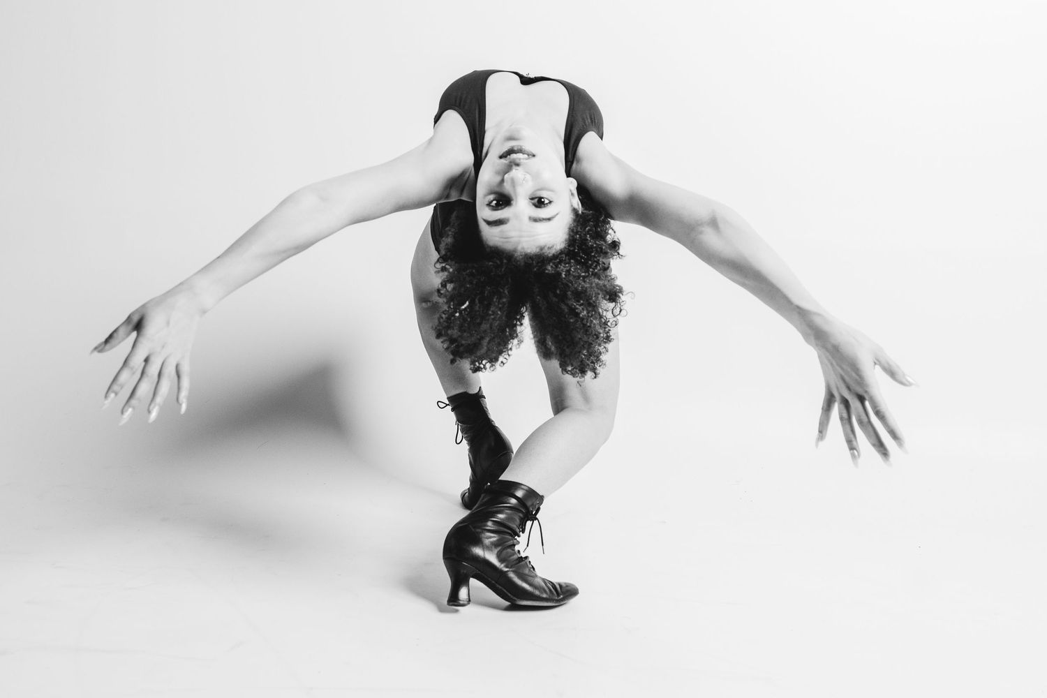 Black and white photo series showing dynamic dance poses with graceful movements and artistic expressions.