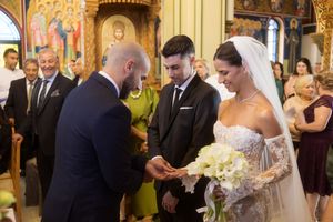 Wedding ceremony moments captured in a beautifully decorated church with warm lighting and elegant decor.