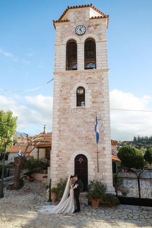 Stone bell tower of a Mediterranean church against blue sky shown from multiple angles.