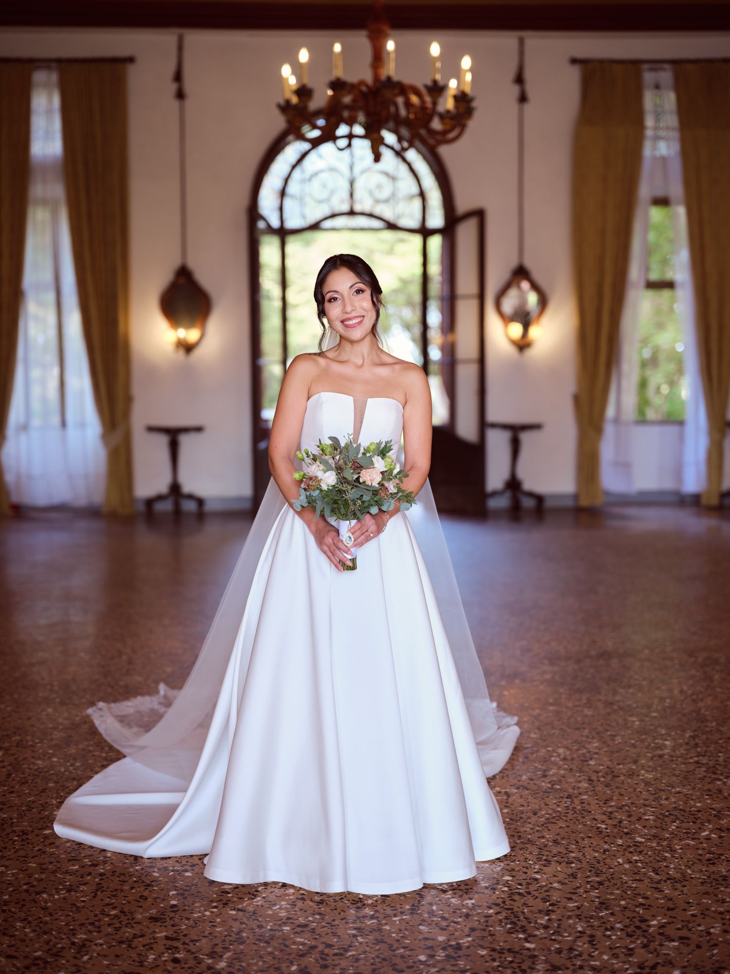A sequence of bridal portraits showing a white wedding gown with flowing train in an elegant ballroom setting.