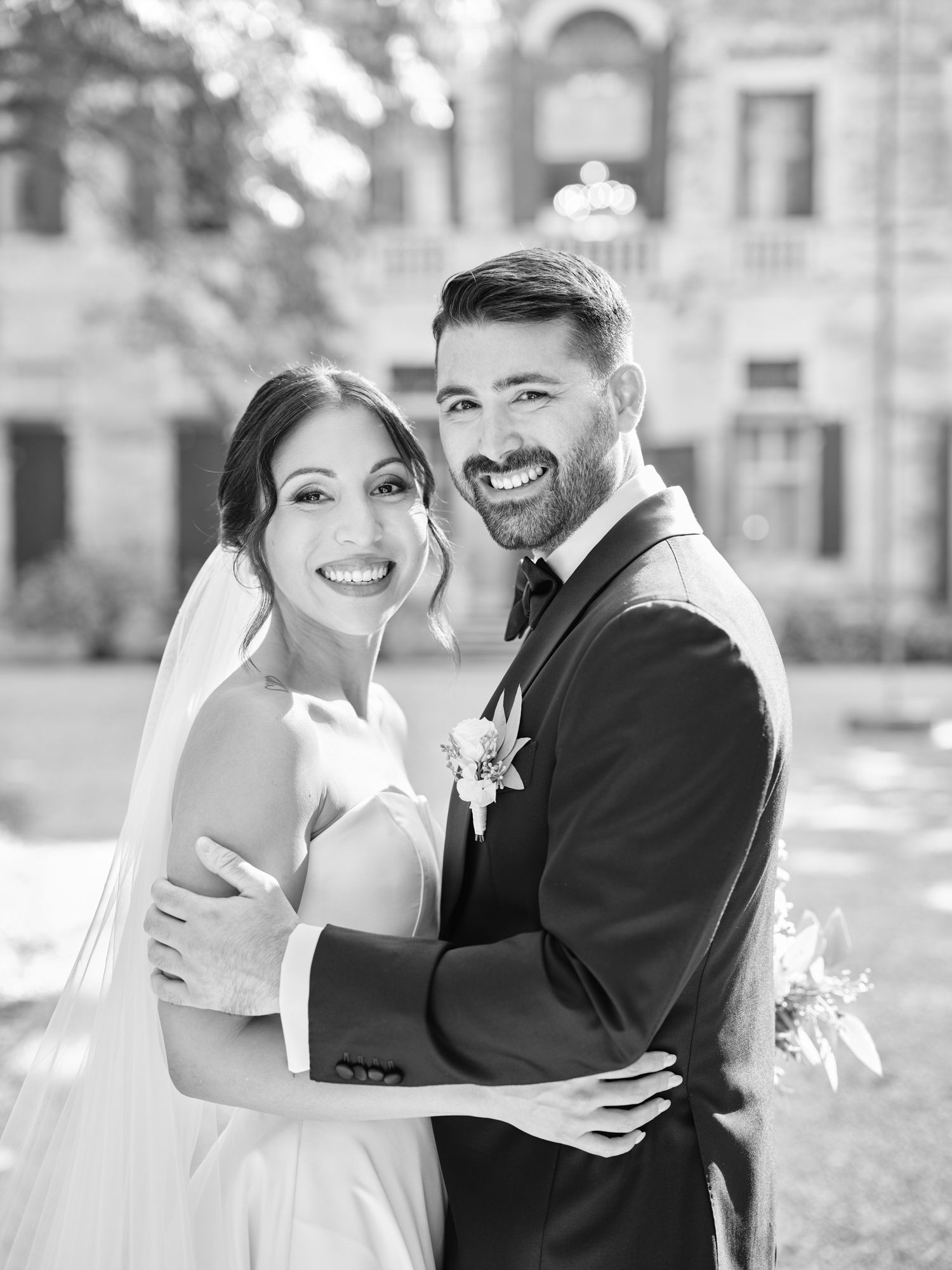 A black and white wedding photo collage showing joyful moments between a couple in formal attire.
