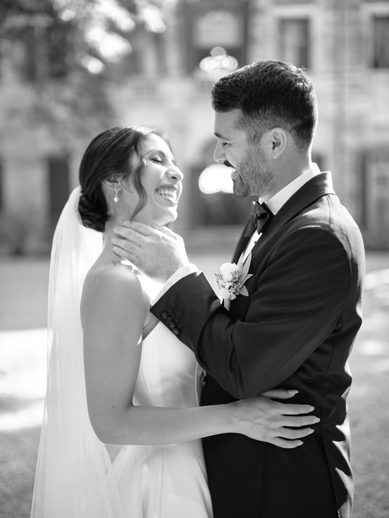 A romantic black and white wedding photo series showing a couple embracing and sharing intimate moments in formal attire.