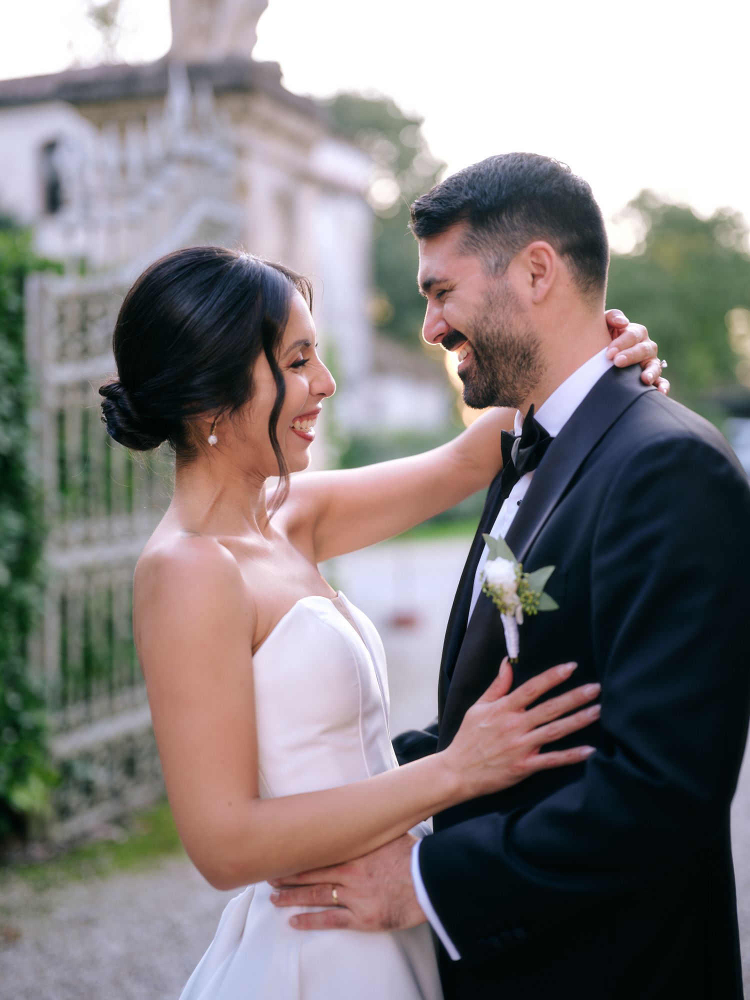 A romantic wedding couple shares intimate moments in a series of black and white photographs outdoors.
