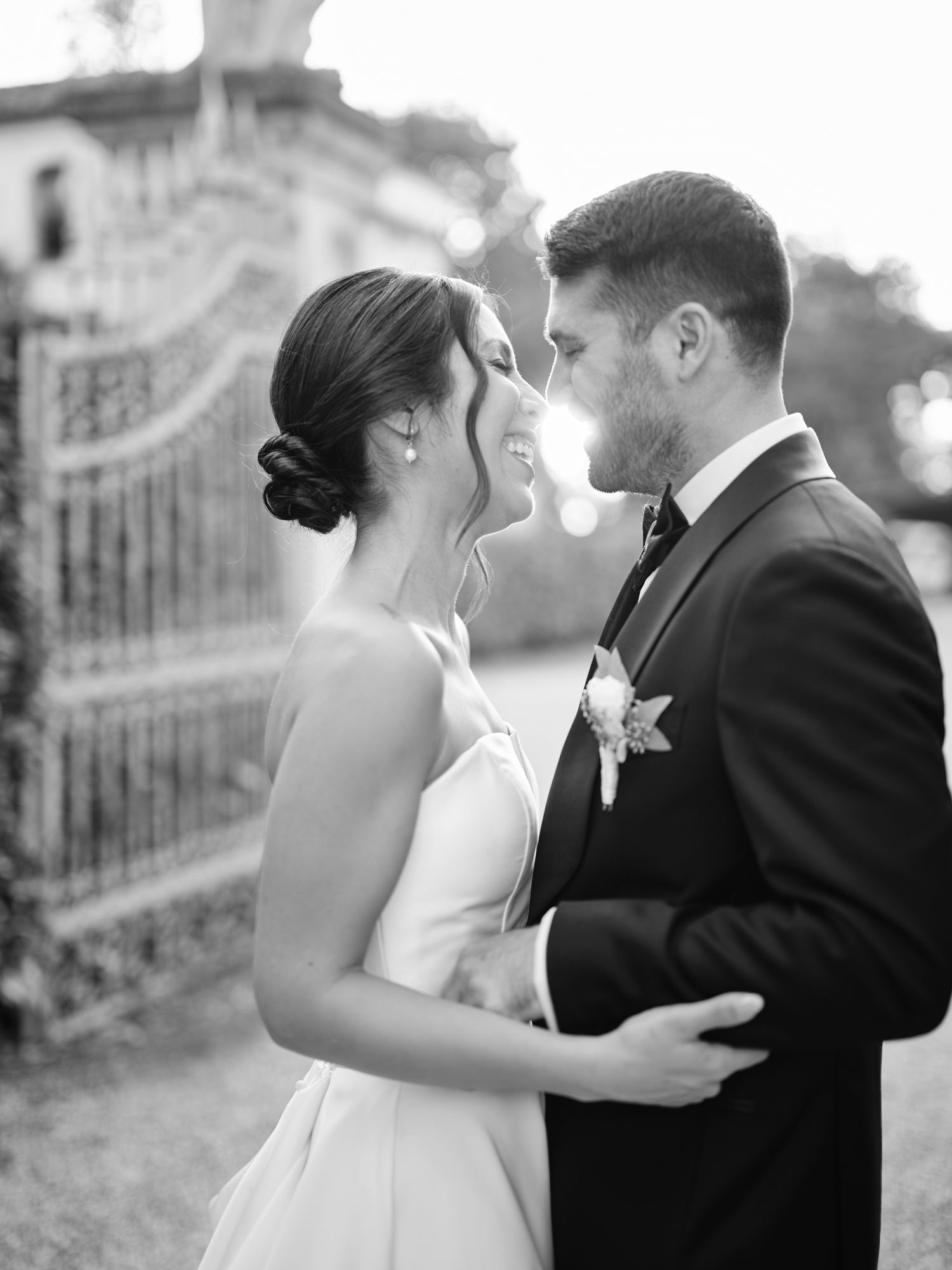 A romantic black and white photo sequence shows a couple in wedding attire sharing tender moments outdoors.
