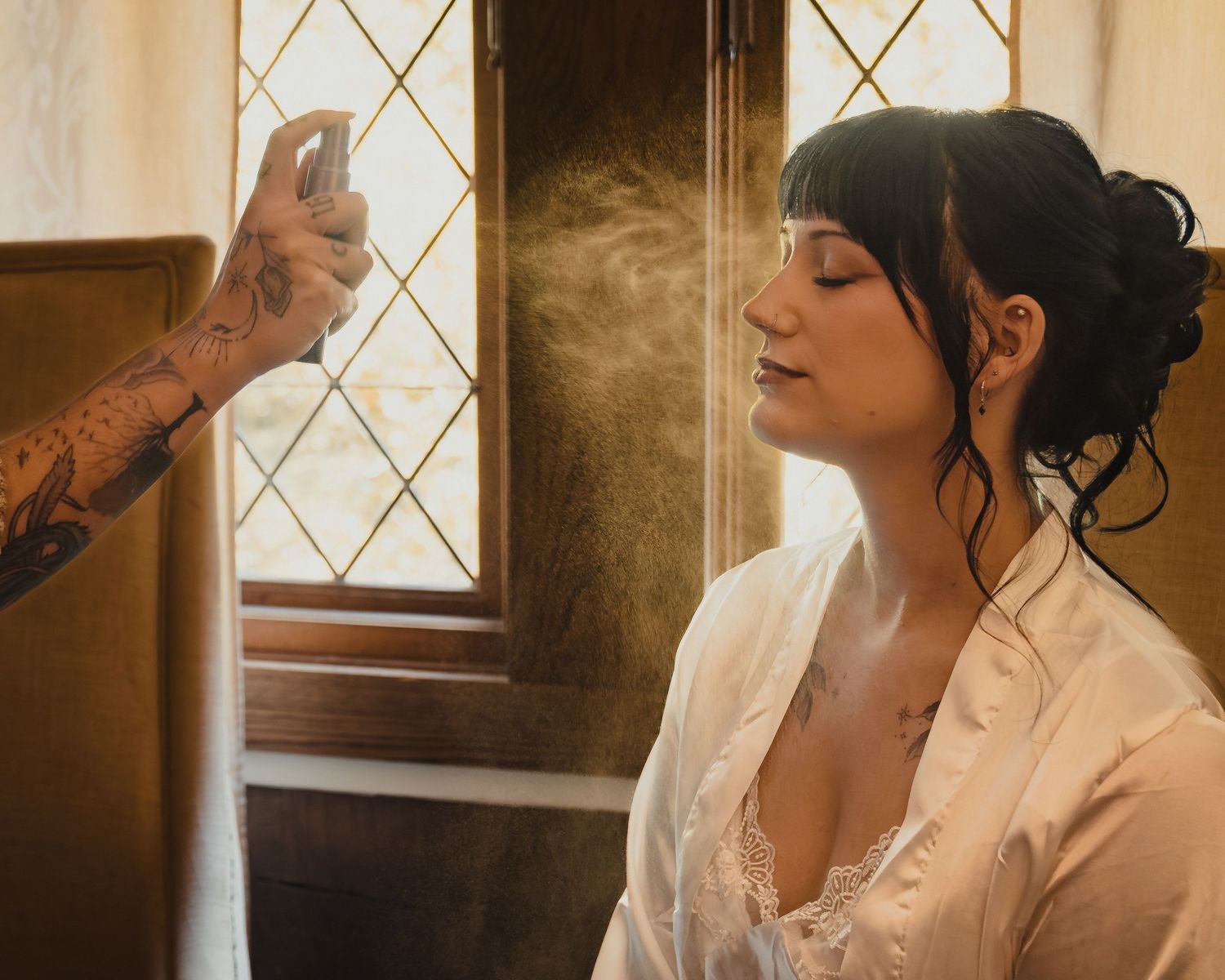 Romantic couple in vintage setting with warm lighting and soft window glow creating intimate atmosphere.