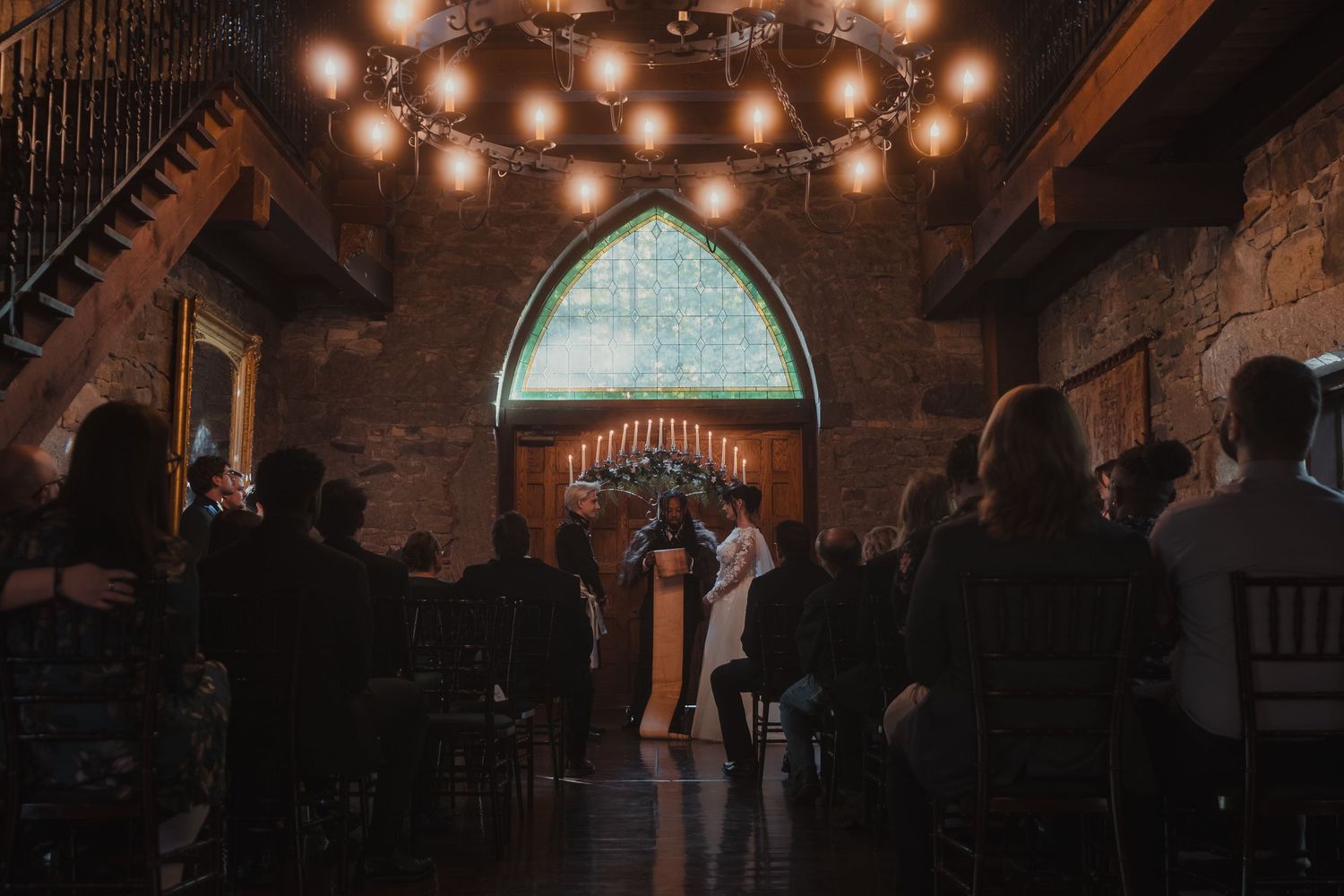 Dimly lit gothic cathedral interior with stone archways and glowing lights creating a dramatic atmosphere.