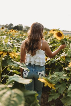senior girl in sunflower field