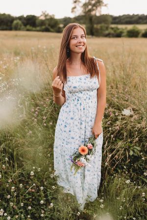 senior girl summer florals farm field blue and white dress