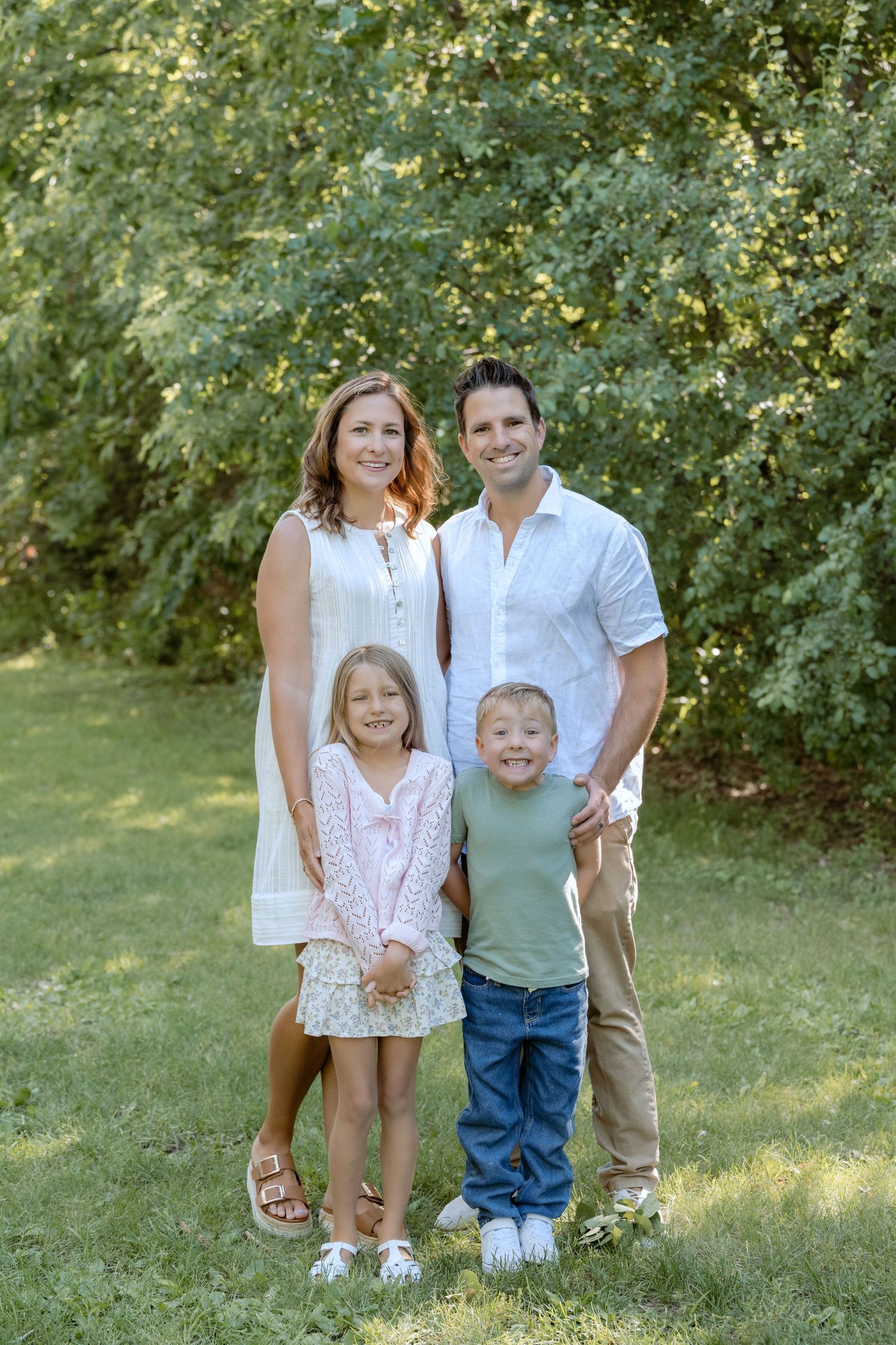 single family unit portrait during multi generational family session at powers lake park in woodbury mn