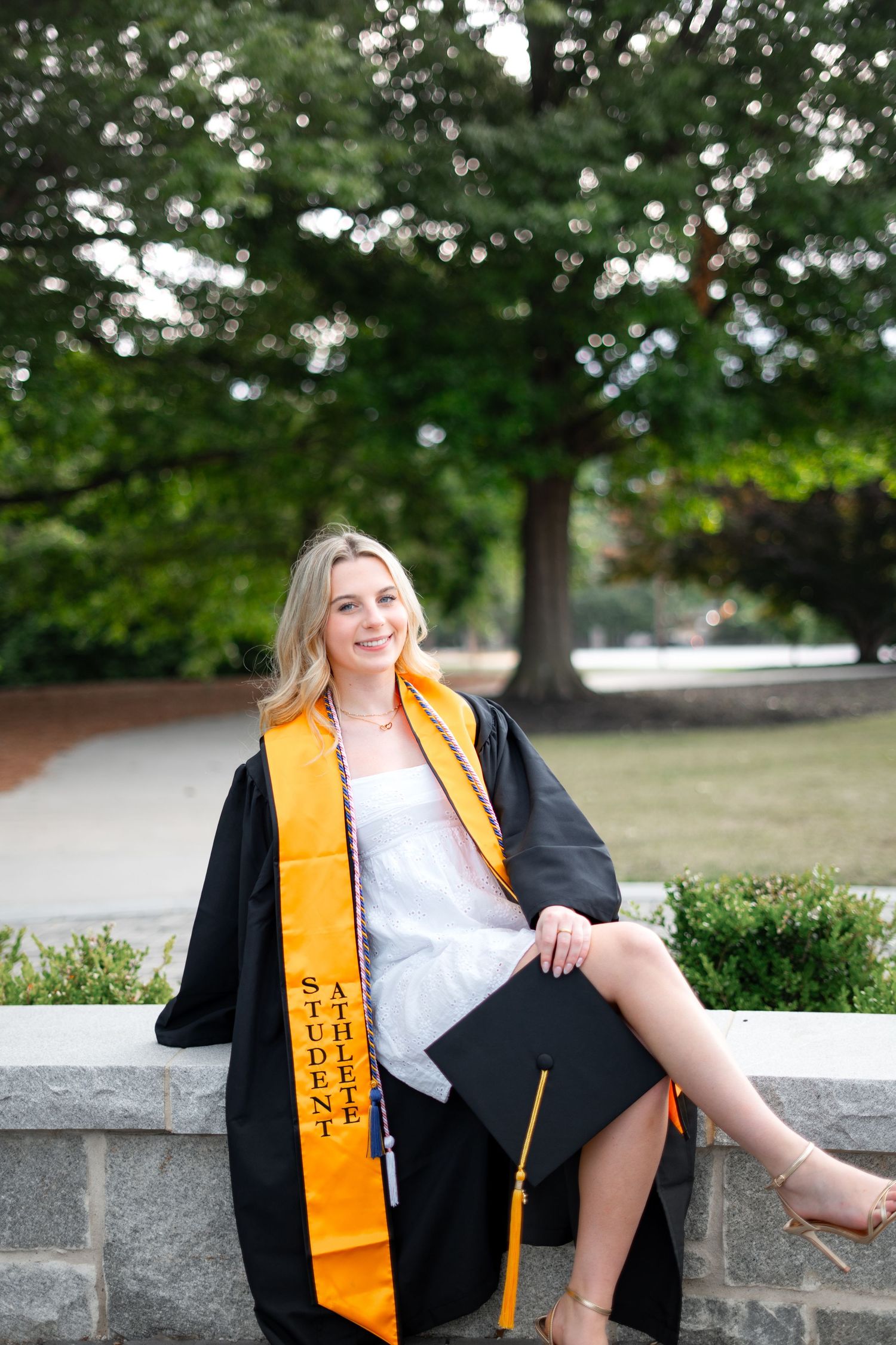 Oglethorpe graduation photos in the center of campus, one of the best spots for Oglethorpe grad portraits in atlanta georgia