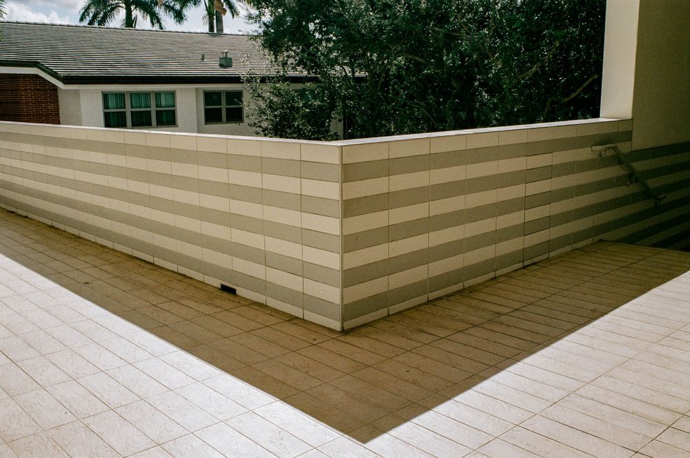 Architectural detail of modern building exterior with horizontal striped pattern.