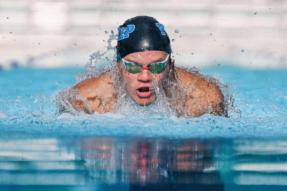 male swimmer swims breaststroke