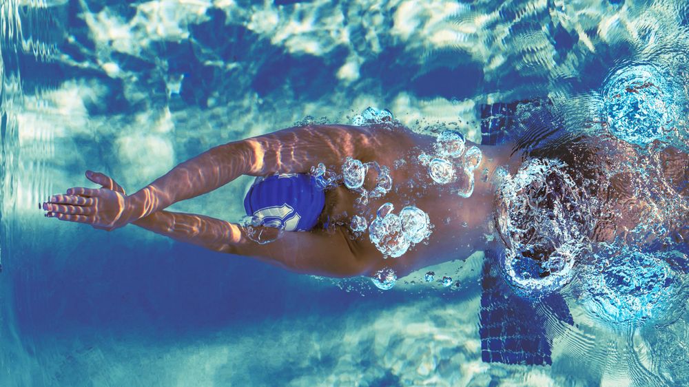 artistic photo of male swimmer