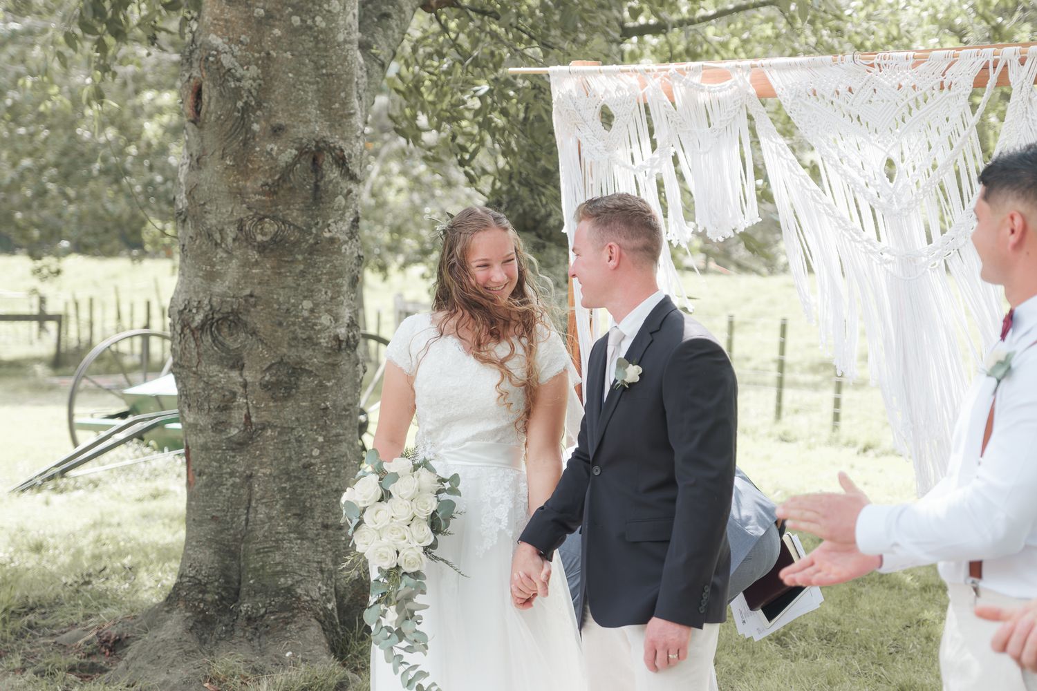 Photo of a young couple that have just got married. edited in a light and airy style