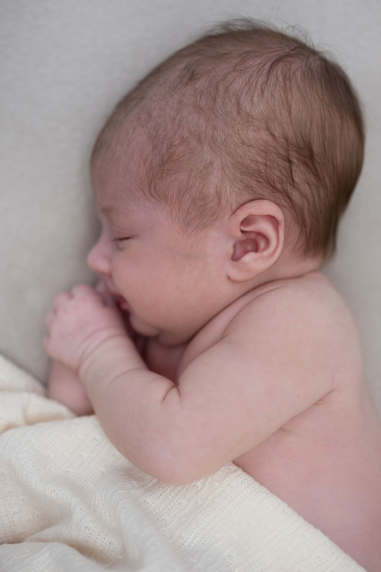 side profile of newborn baby sleeping