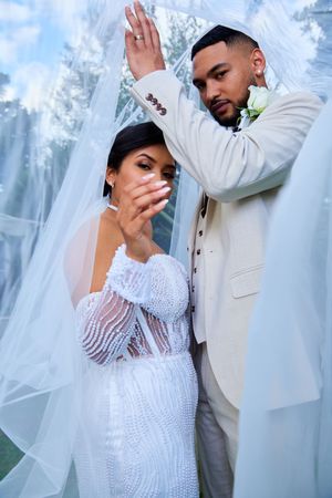 Artistic wedding photos showing couple in intimate poses against ethereal background.