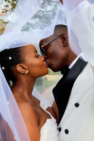 Romantic close-up shots of newlyweds sharing intimate moments during their wedding.