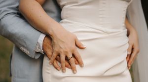 A series of photos showing a person in a white shirt and gray pants adjusting their clothing.