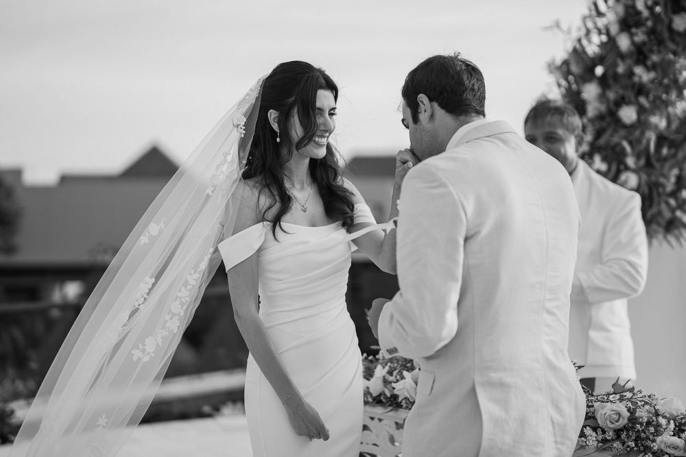 Black and white wedding photography capturing intimate moments during the ceremony.
