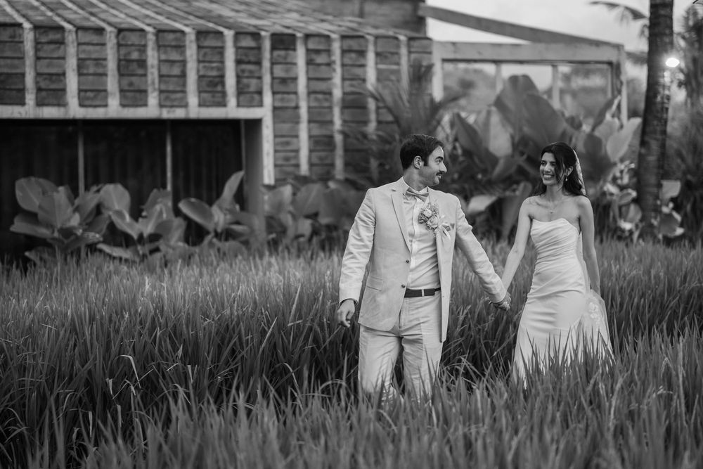 Black and white photo series capturing intimate moments in a garden setting.