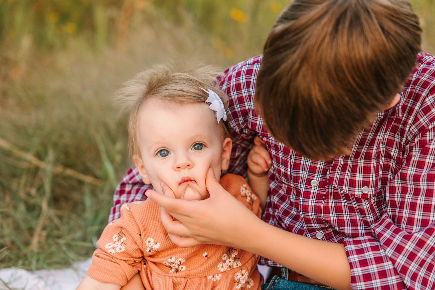 A series of candid moments captured between two people in a natural outdoor setting.