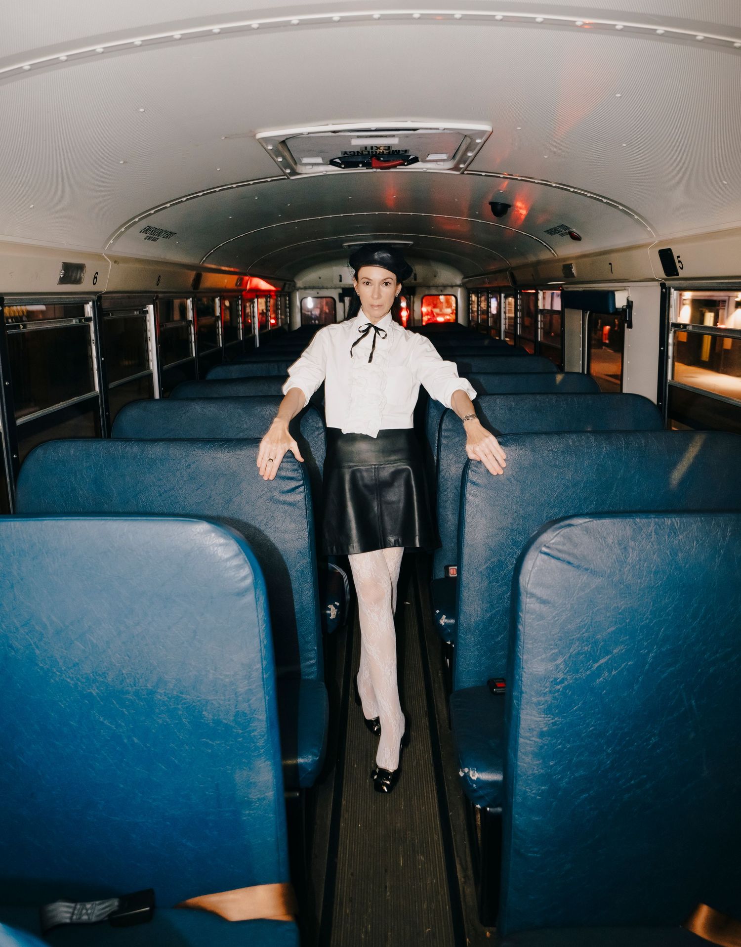 Inside a school bus, someone appears to perform an energetic dance sequence showing increasing movement across the photo series.