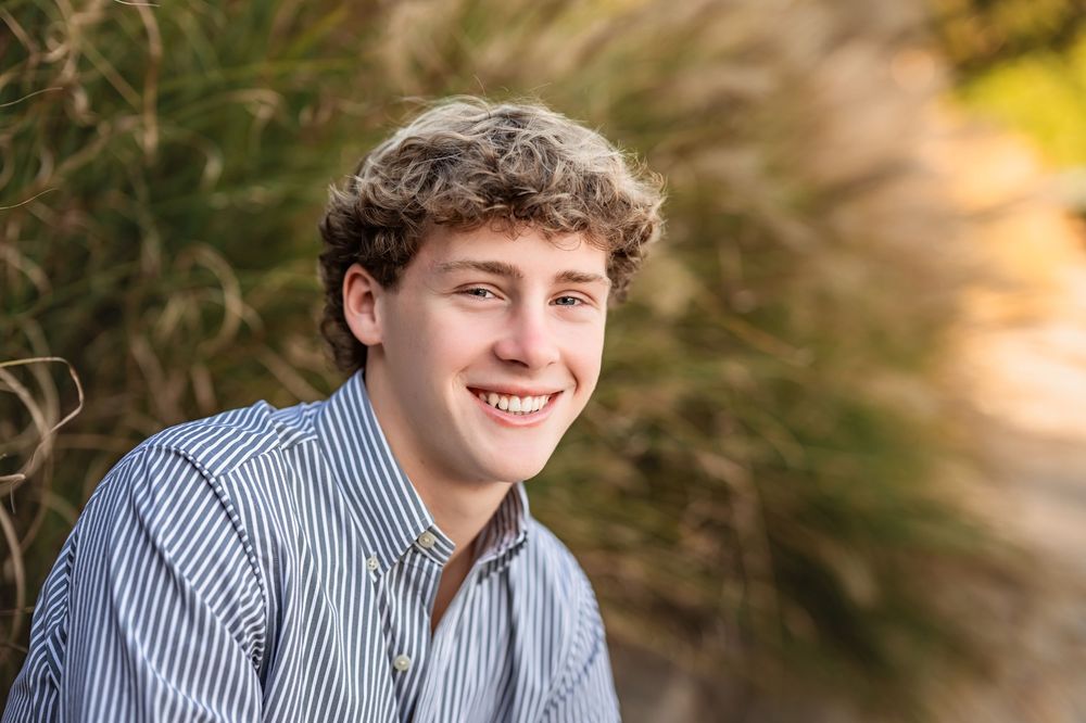 Senior boy headshot in Coolidge Park for Chattanooga senior photo session.