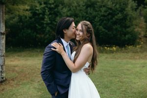 Romantic outdoor wedding portraits captured in a lush green field. Luxury Estate Wedding Photographer in NC