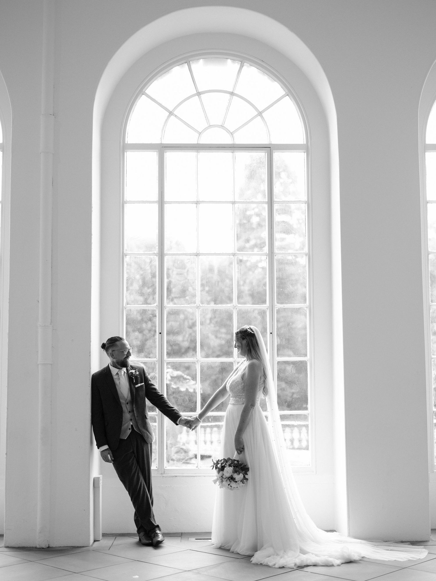 bride and groom at margam orangery in black and white
