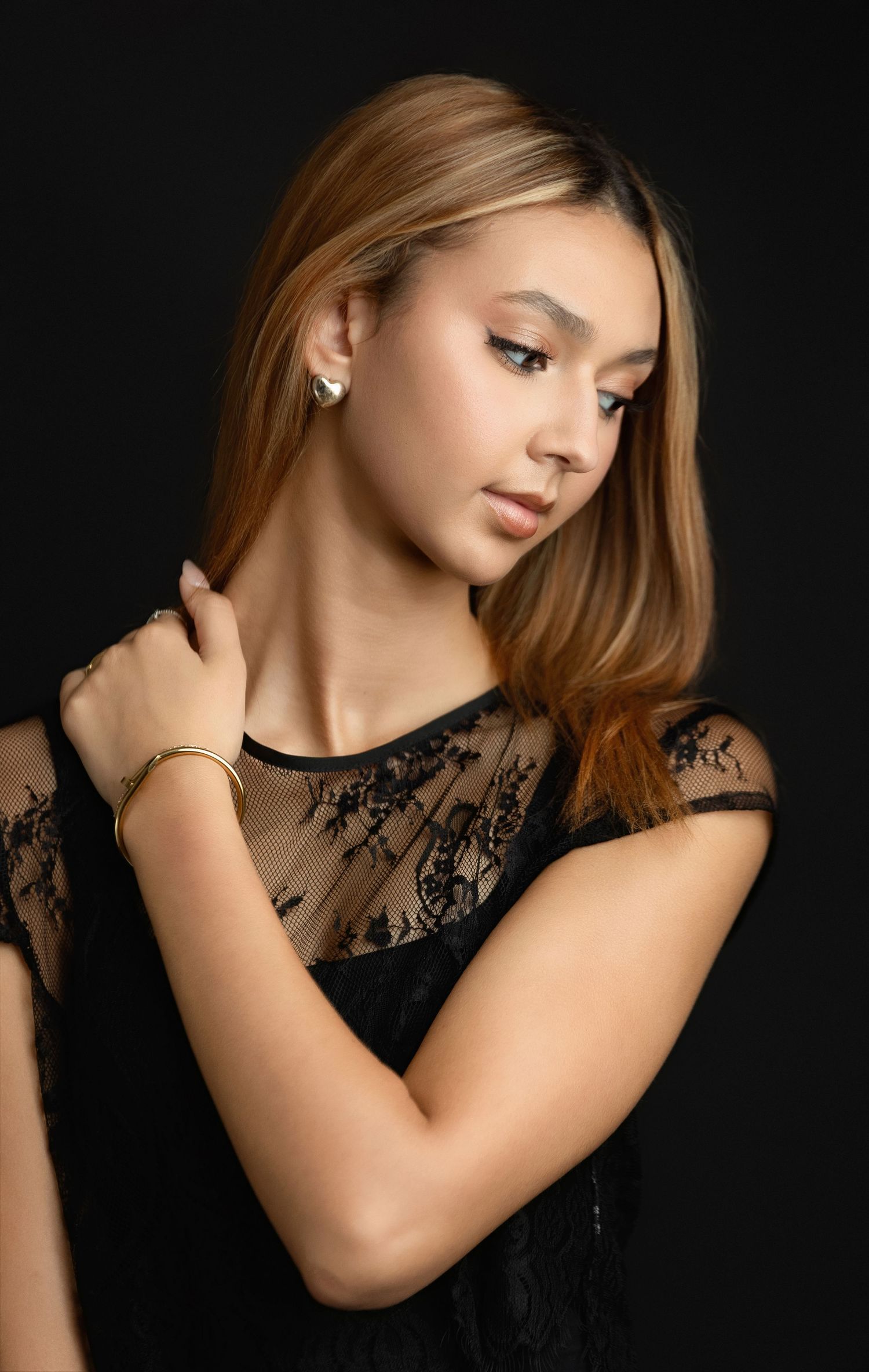 The Greenville model is looking straight, wearing a black top. Greenville SC newborn photographer - Easley SC photographer