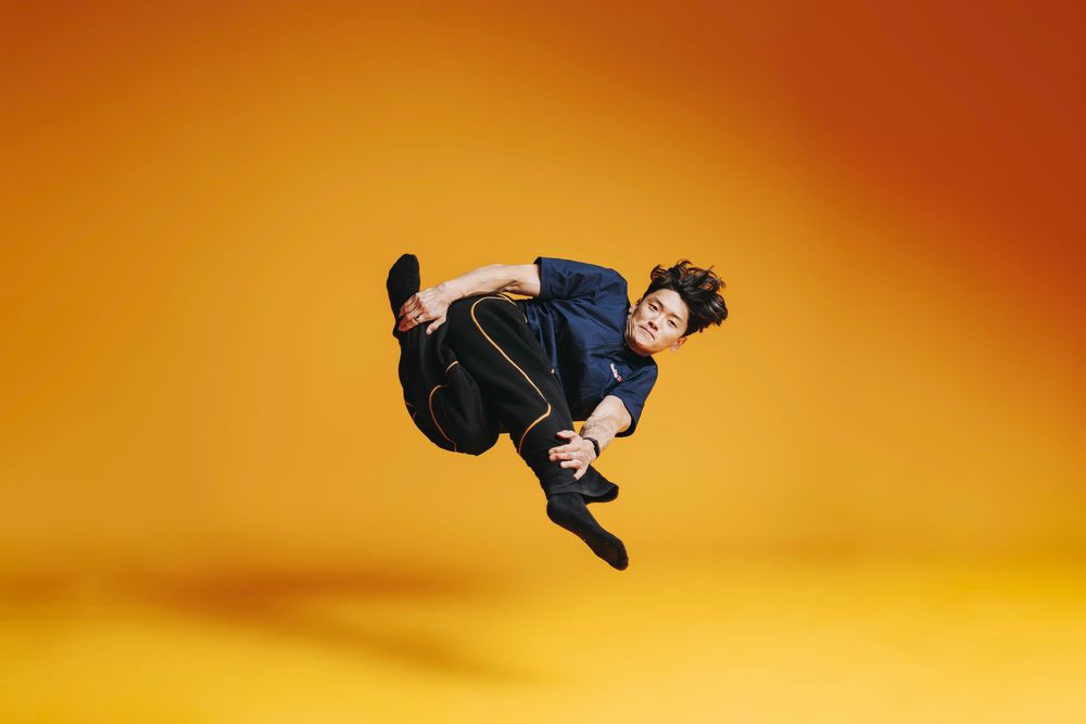 Sequence showing a skateboarder performing a backflip trick against an orange sunset sky background.