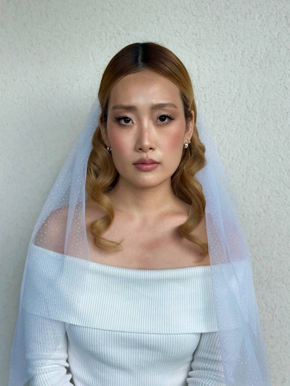 Cambridge bridal makeup artist creating soft glam wedding look.