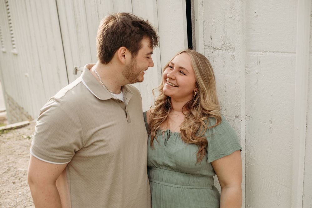 Intimate candid moments captured between people during an outdoor photoshoot.