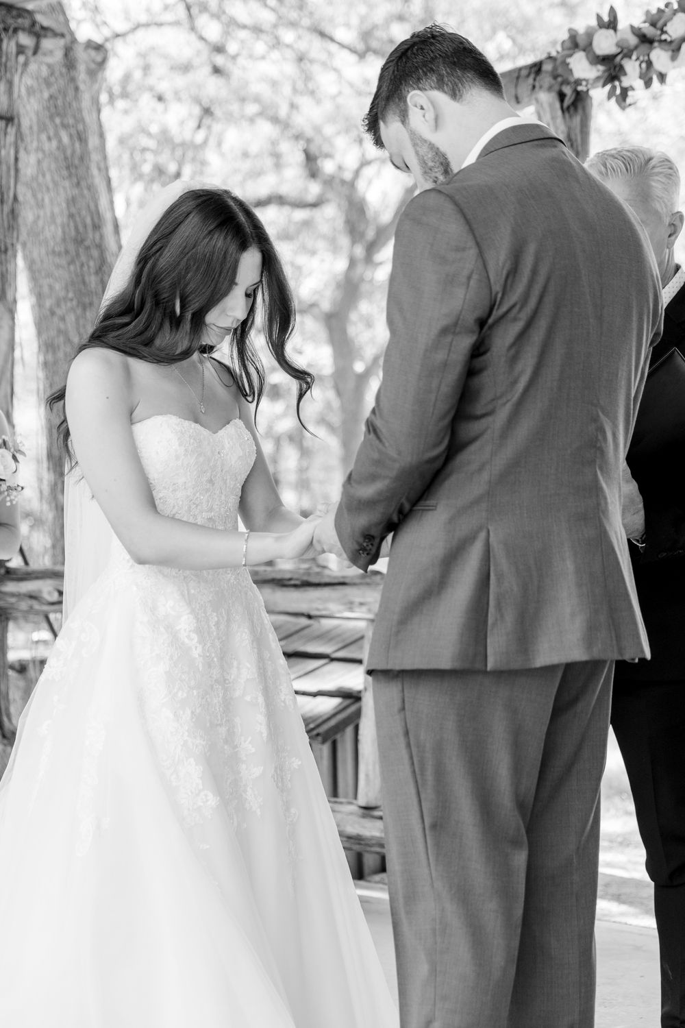 Bride and groom praying in a luxury christian wedding in Austin texas.